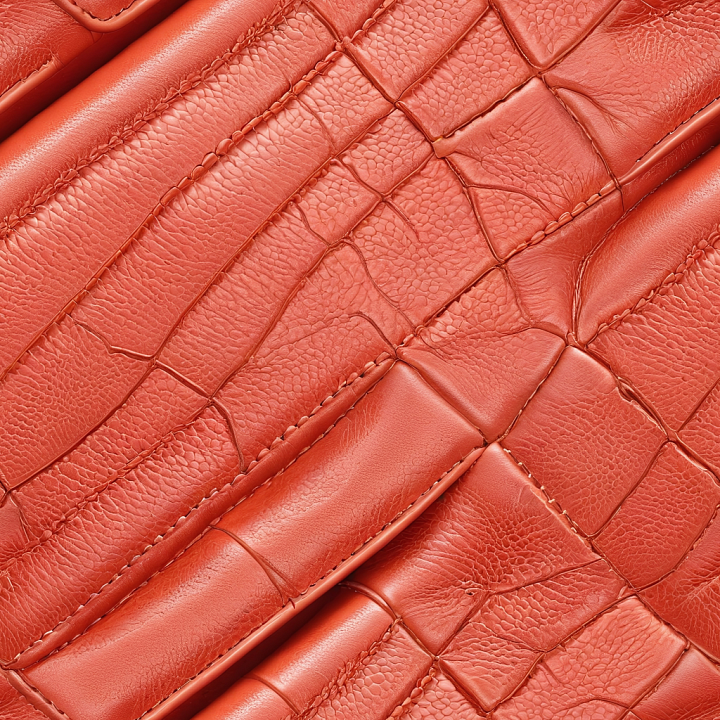 Stitched Glossy Orange Patched Leather With Detailed Grain And Creases seamless PBR texture preview