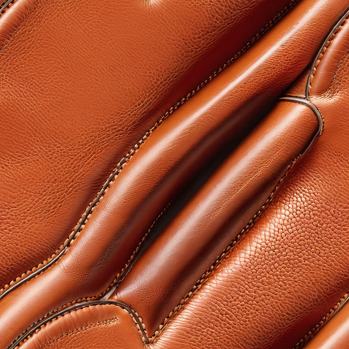 Brown Pebbled Leather with Detailed Stitching and Smooth Panels seamless PBR texture preview