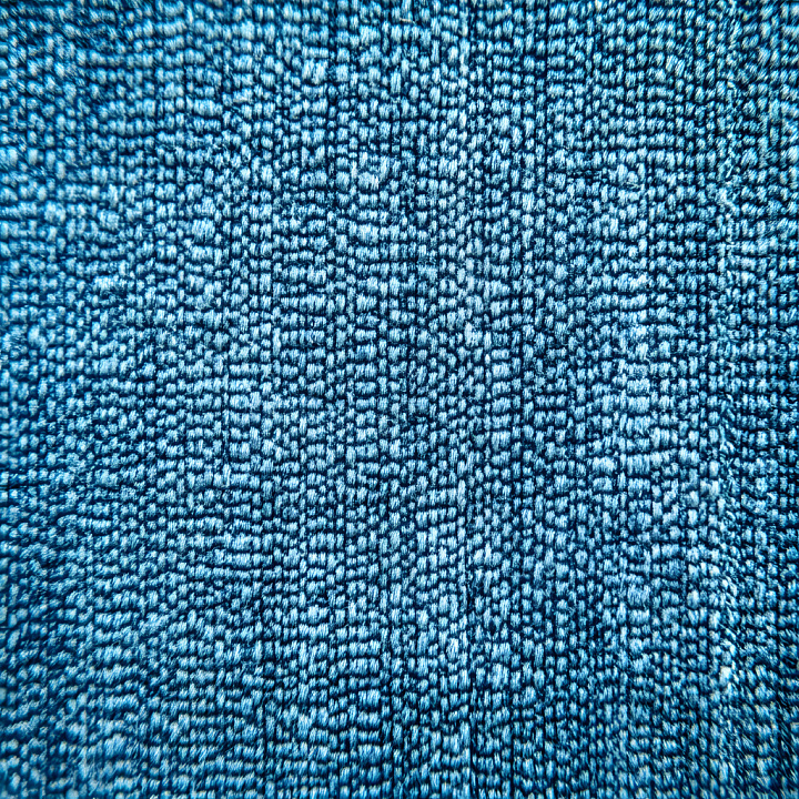 Cracked And Textured Denim Fabric With Intricate Blue Fibers seamless PBR texture preview