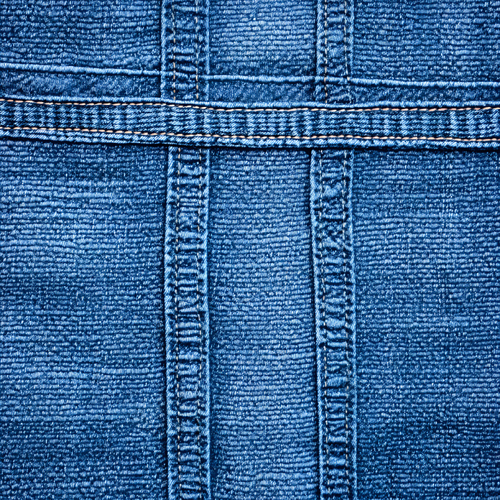Cracked Denim Fabric with Blue Tones and Stitching Detail seamless PBR texture preview