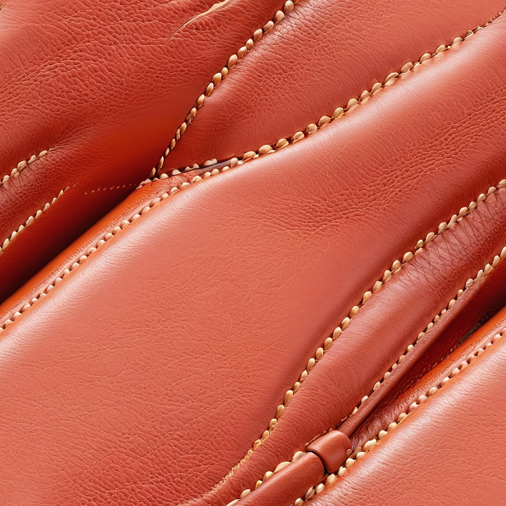 Smooth Reddish Leather Featuring Prominent Stitching and Soft Grain seamless PBR texture preview