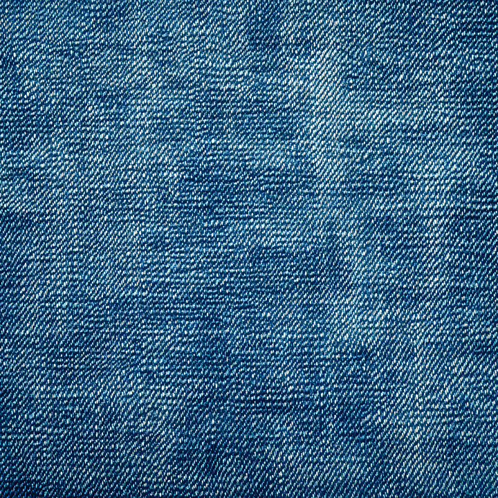 Distressed Blue Denim Fabric with Worn and Faded Areas seamless PBR texture preview