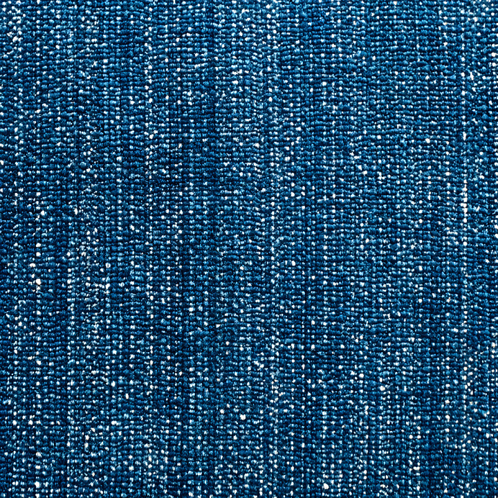 Blue Denim Fabric Featuring Worn Holes and Distressed Weave seamless PBR texture preview