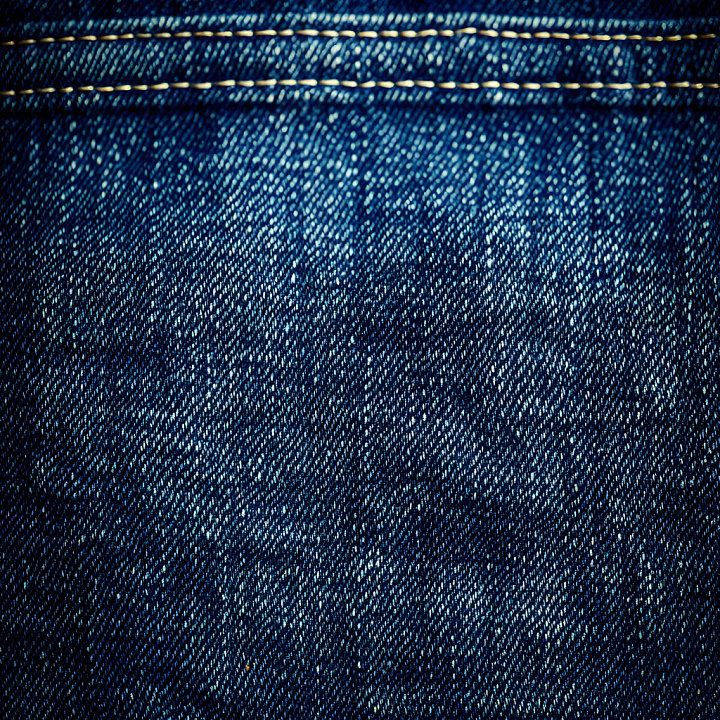 Cracked Denim Fabric With Distressed Blue Shades And Stitching seamless PBR texture preview